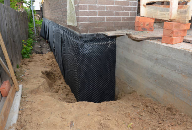 Happy homeowners after waterproofing job in Wenonah